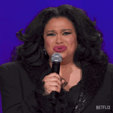 a woman singing into a shure microphone with the word nooo on the bottom