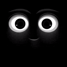a close up of a cartoon character 's eyes in the dark
