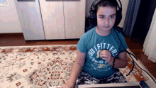 a boy wearing headphones and a outfitters shirt