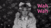 a black and white photo of a girl with wah wah written in pink