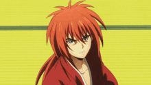 a man with red hair is holding a sword