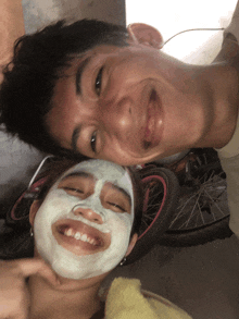 a man and a woman with white face masks on