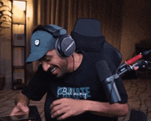a man wearing headphones and a shirt that says private laughs