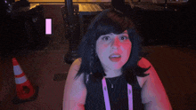 a woman in a wig says good in a video