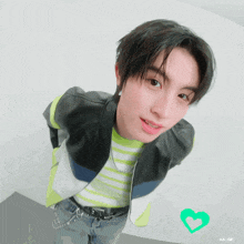 a gif of a young man with a heart in the corner