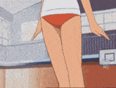 a girl wearing a white shirt and red underwear is standing in a gym