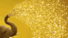 Elephant Gold GIF - Elephant Gold Spray GIFs
