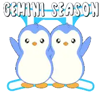two penguins are standing next to each other with the words gemini season written above them