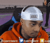 a man wearing a headband that says 3wp