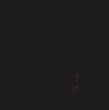 a close up of a person 's face with a dark background