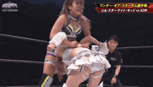 a wrestling match with #stardom written on the bottom right