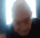 a close up of a person 's face with the sun shining through the window