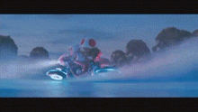 a person is riding a motorcycle on a snowy surface .