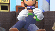 a video game character is sitting on a couch playing a game of pong