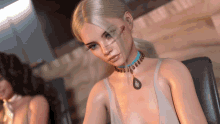 a woman wearing a necklace with a blue pendant