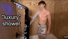 a shirtless man taking a luxury shower with the time 14:27