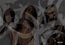 three women are standing next to each other with a watermark that says rbd.gif at the bottom