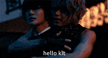 a man in a tuxedo is hugging another man with the words hello kit written on the bottom