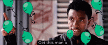 a man is surrounded by green balloons and a caption that says " get this man a "