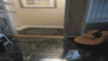 a person is playing an acoustic guitar in a room