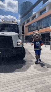a mascot wearing a edmonton oilers jersey walks down a street