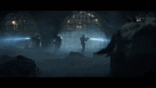 a group of soldiers are standing in a dark room