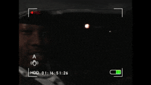 a man 's face is being recorded on a camera with hdd written on the bottom