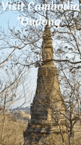 a picture of a statue with the words visit cambodia on the top