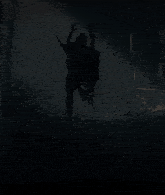 a person with a skull on their head in a dark forest