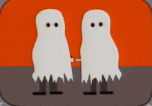 two ghosts are standing next to each other and one is holding a knife