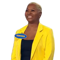 a woman wearing a yellow jacket and a name tag that says tenesha