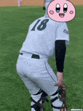 a baseball player with the number 18 on the back of his shirt