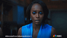 a grosse pointe garden society ad with a woman in a blue top