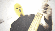 Playing Bass Intruder Yellow GIF - Playing Bass Intruder Yellow Masked Intruder GIFs