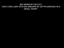 a billboard with a picture of a cat and the words big worm in the city