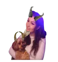 a woman with horns on her head is holding a small brown dog