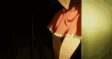 a girl in a pink skirt is standing in a dark room .