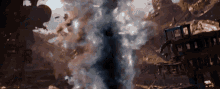 a large explosion with smoke coming out of the middle of it