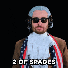 a man wearing a wig and sunglasses has the words 2 of spades above his head