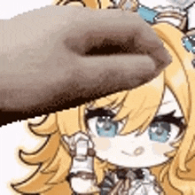 a close up of a person 's hand touching a girl 's head .