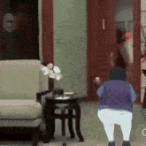 a cartoon of a man standing in a living room