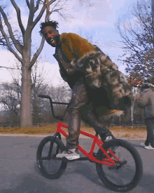 a man in a fur coat is riding a red bmx bike