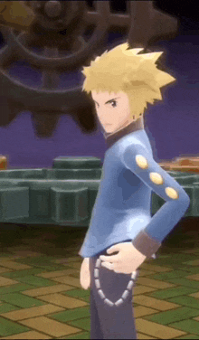 a man with yellow hair is standing with his hands on his hips .