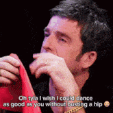 a man is crying while holding a red napkin with the words oh tyla i wish i could dance as good as you