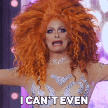 a drag queen with red hair is making a funny face and says i can 't even