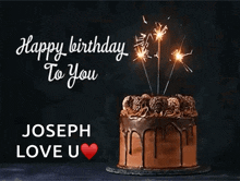 a chocolate birthday cake with sparklers on it and the words happy birthday to you joseph love u