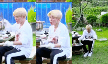 a man in a white shirt is sitting on a bench eating