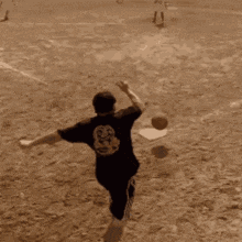 a man in a black shirt with the number 8 on the back
