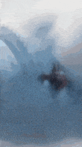 a painting of a person swimming in a body of water