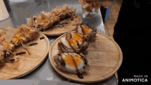 three plates of food on a table with the words made in animotica on the bottom right